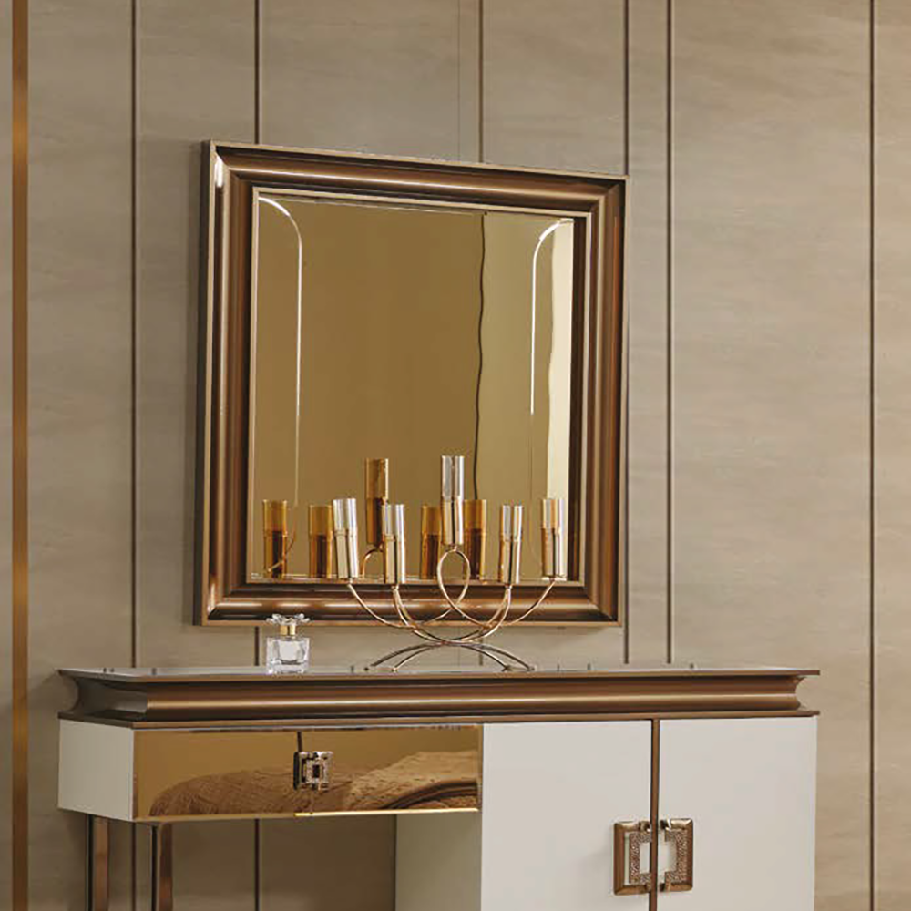 Elegant vanity with a white and gold finish, a large framed mirror above, and a gold candelabra on the tabletop.