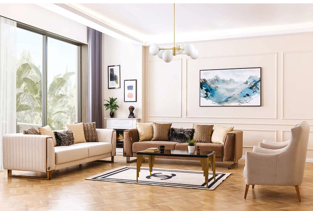Bright living room with cream and tan sofas a glass coffee table and two cream chairs facing a wall with framed art