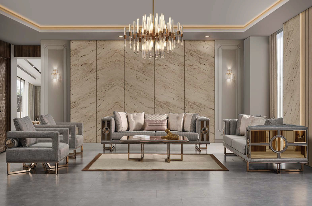 Luxurious contemporary living room with marble paneled wall large crystal chandelier and grey upholstered sofas around a glass coffee table