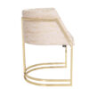 Beige velvet upholstered bar stool with a gold metal cantilever frame and circular base