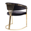 Luxurious black upholstered curved chair with a gold metal frame and circular base modern accent seating