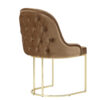 Brown tufted velvet accent chair with a curved back and gold metal circular pedestal base