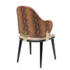 Dining chair with brown snakeskin upholstery black tapered legs and gold metal back supports from the MeTuNzI brand side view