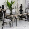 Luxurious black and silver dining table set with six upholstered chairs on a marble floor centerpiece candelabra