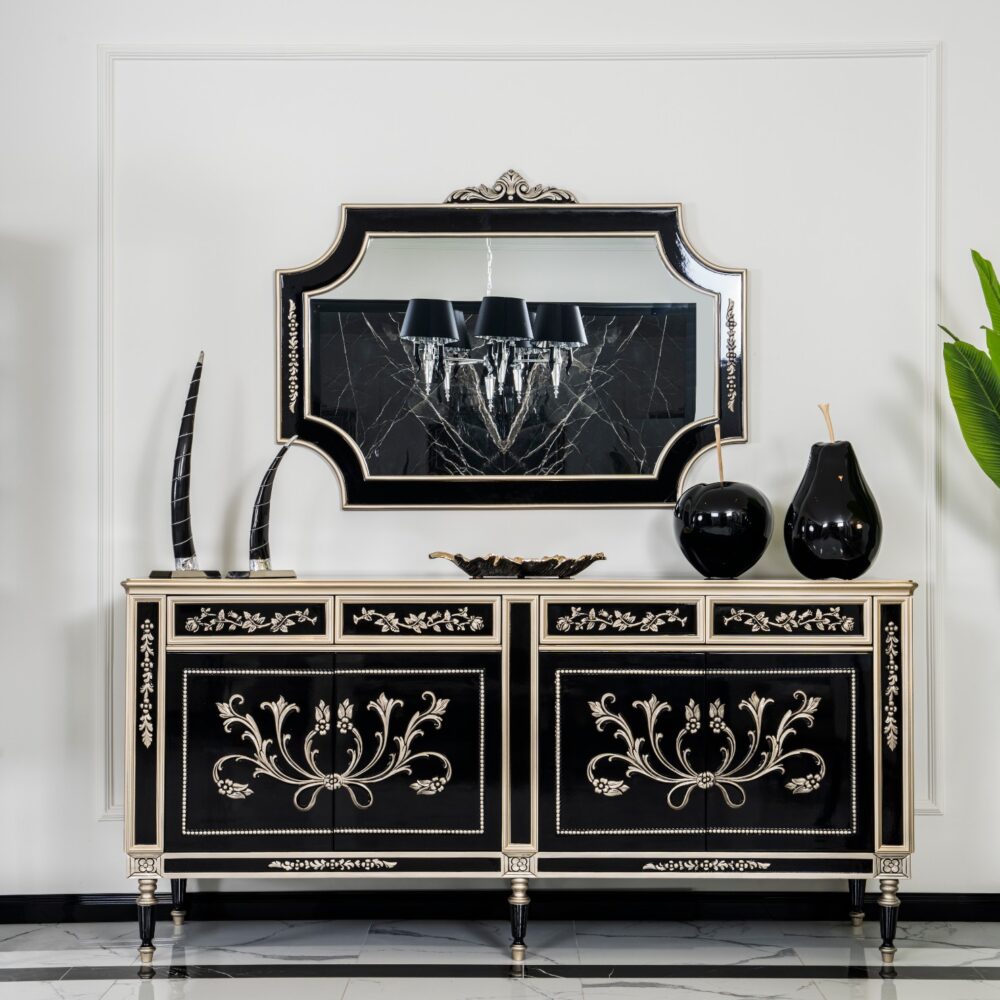 Luxurious black-and-gold sideboard with intricate floral inlay and a large ornate mirror above it on a pale wall.