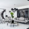 Luxurious black and silver living room with marble floors and ornate furniture accents