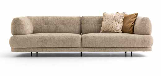 Beige fabric sofa with two cylindrical armrests and three decorative cushions on the right side.