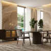 Modern dining area with a round table four grey chairs a dark sideboard and marble walls bathed in natural light from large windows