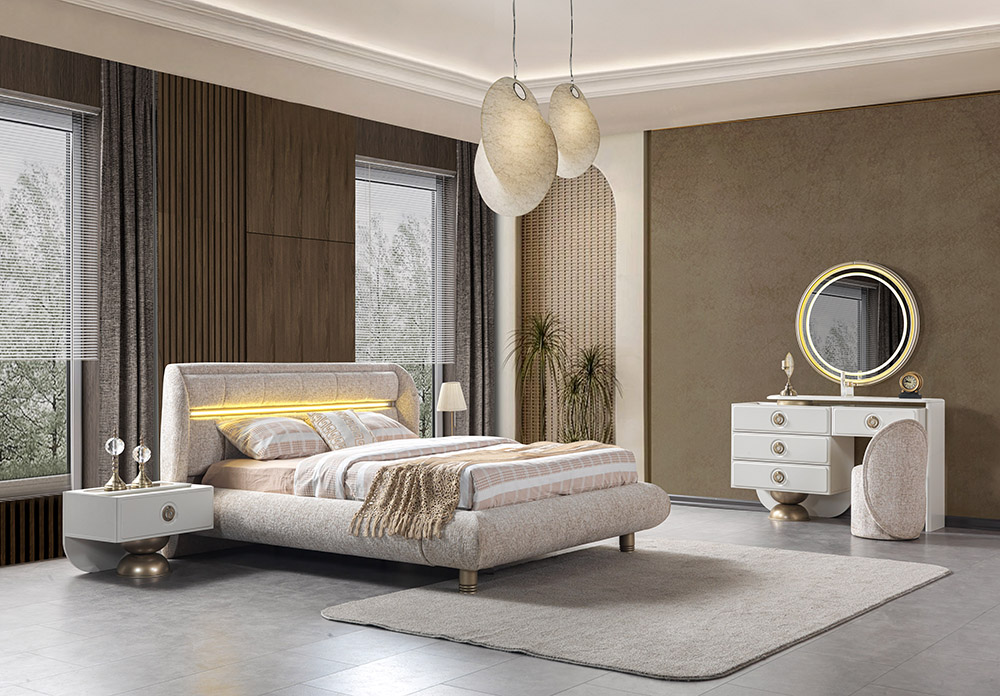 Modern beige and white bedroom with an upholstered low-profile bed, matching nightstands, and warm ambient lighting.