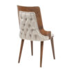 Wooden mid century chair with beige tufted fabric upholstery on the back and seat curved sides and four tapered legs