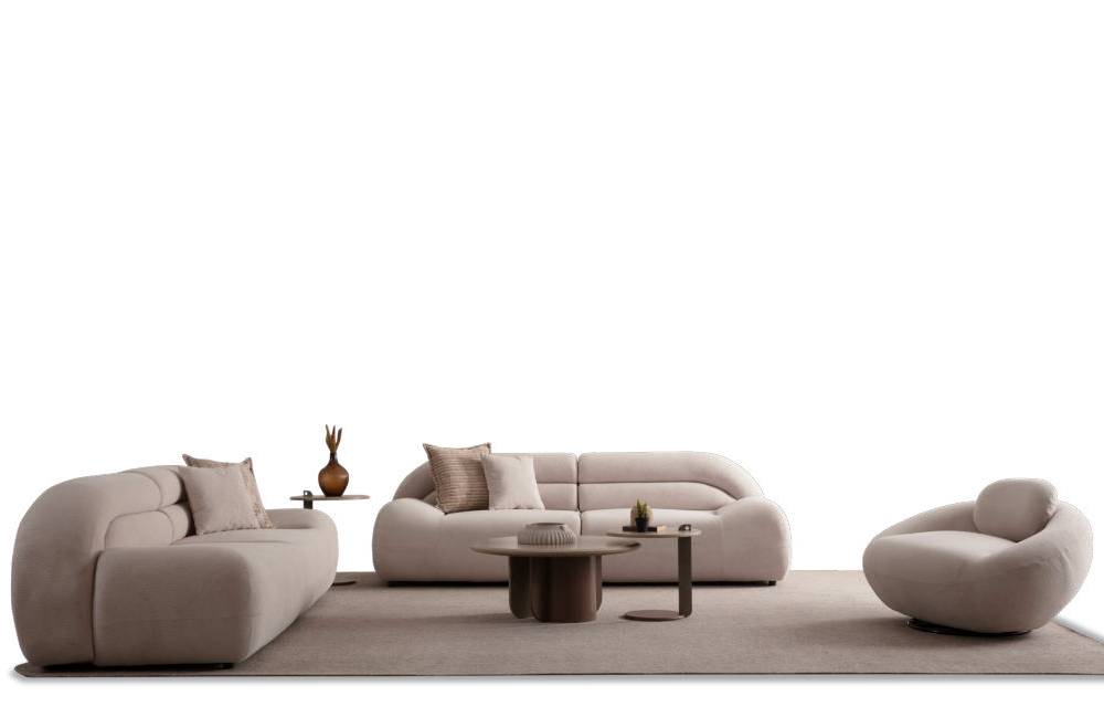 Beige modular sectional sofa set on a cream rug with matching cushions, two round coffee tables, and a curved chair against a black background.