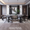 Modern dining room with an oval marble table six upholstered chairs a gold sculptural base greenery and abstract wall art