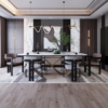 Elegant modern dining room featuring a large marble oval table sculpted base and eight upholstered chairs in neutral tones beneath a wave like pendant light Two green vases and a plant centerpiece add greenery while marble and wood wall panels create a luxurious backdrop