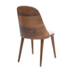 Wooden dining chair with a curved back and light fabric upholstery on the seat and rim four tapered legs viewed from the side