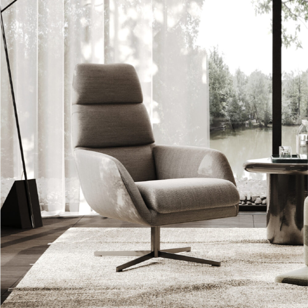 Modern gray swivel lounge chair with high back in a sunlit living room, next to a glass-topped table and sheer-curtained windows overlooking a garden pond.