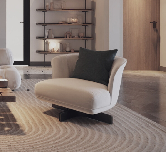White lounge chair with a dark green pillow sits on a patterned beige rug in a modern living room with a wooden door and shelving in the background.