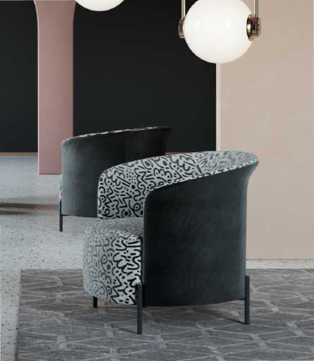 Curved lounge chair with dark blue exterior and patterned gray fabric interior in a modern room with pendant lights.