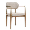 Mid century modern beige fabric armchair with tan wooden legs and brass accents
