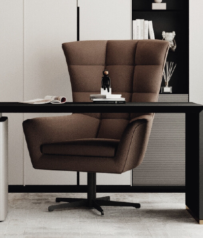 Brown upholstered swivel desk chair at a black desk in a modern home office, with books and decor on a shelf behind.
