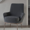 Dark gray upholstered lounge chair with curved arms and light wood legs on a beige rug in a modern living room