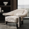 Beige textured fabric armchair with curved back and wooden legs in a modern living room setting