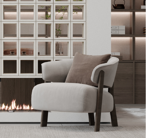 Beige upholstered armchair with wooden legs beside a linear fireplace in a modern living room.